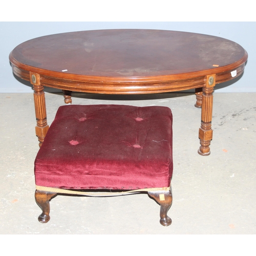 63 - A good quality modern oval coffee table and a small red velvet topped footstool (2)