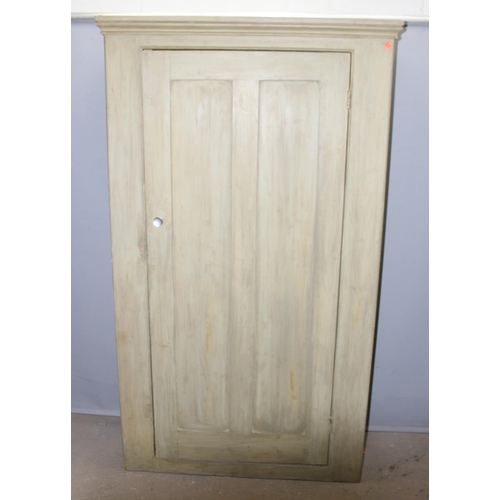82 - A vintage painted pine hall cupboard with interior low shelf and various hangers, likely late 19th o... 