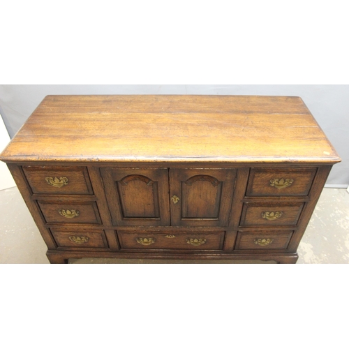 48 - Titchmarsh & Goodwin of Ipswich, a Georgian style oak dresser base or sideboard with 7 drawer and a ... 