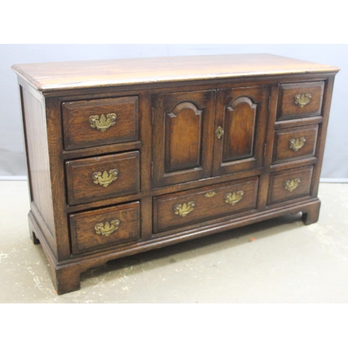 48 - Titchmarsh & Goodwin of Ipswich, a Georgian style oak dresser base or sideboard with 7 drawer and a ... 