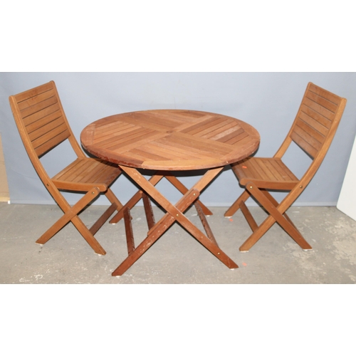 300 - A folding garden table and 2 teak folding chairs, the table approx 100cm wide x 100cm deep x 73cm ta... 