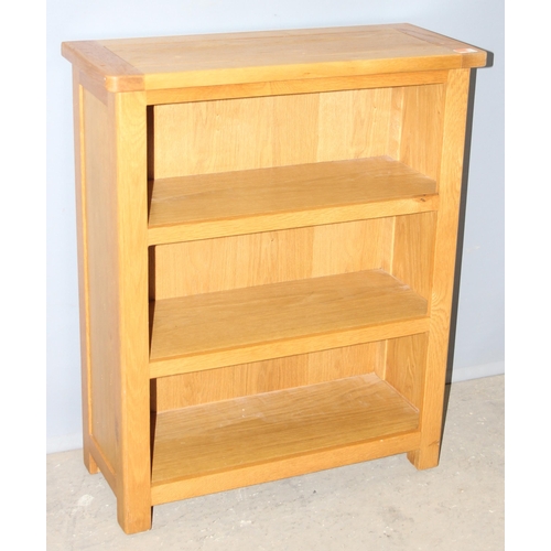 31 - A good quality modern light oak bookcase likely from Oak Furnitureland, approx 70cm wide x 30cm deep... 