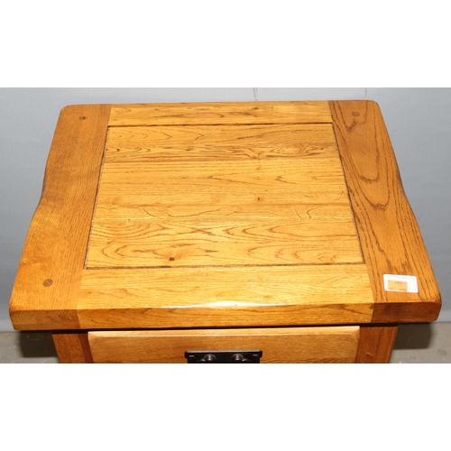 32 - A good quality modern light oak bedside table with iron handle, likely Oak Furnitureland, approx 50c... 