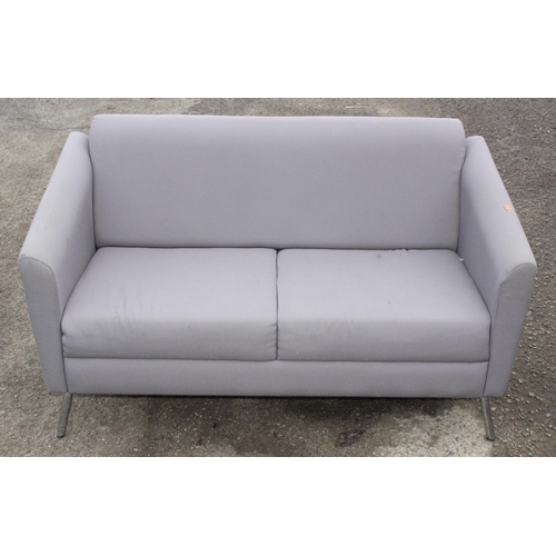 93 - A modern grey 2 seater sofa or settee on chrome legs, approx 139cm wide x 74cm deep x 77cm tall