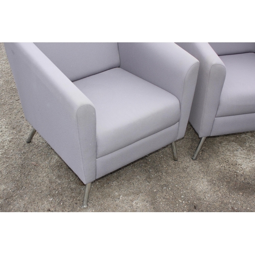 92 - A pair of modern grey covered armchairs with chrome legs, each approx 70cm wide x 73cm deep x 79cm t... 