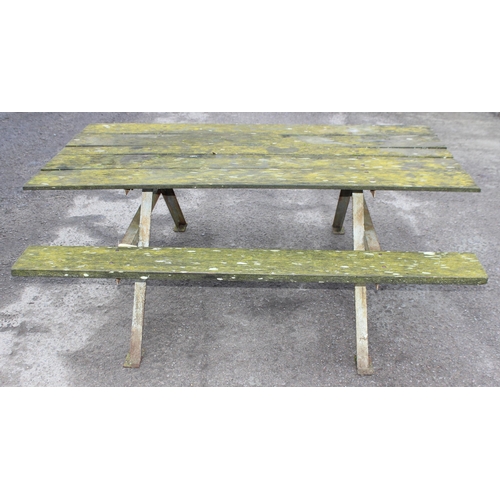 302 - A vintage weathered wooden garden picnic bench with metal frame, approx 183cm wide x 143cm deep x 72... 