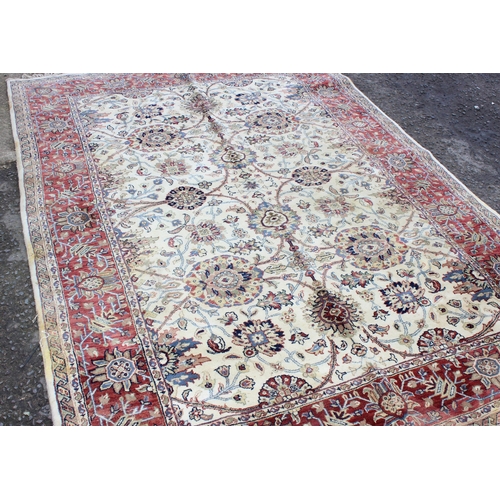 229C - A highly decorative handmade Keshan style rug with cream ground and red border, approx 270cm x 187cm