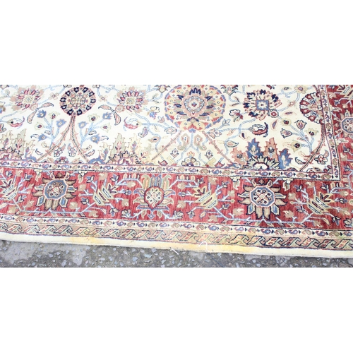 229C - A highly decorative handmade Keshan style rug with cream ground and red border, approx 270cm x 187cm