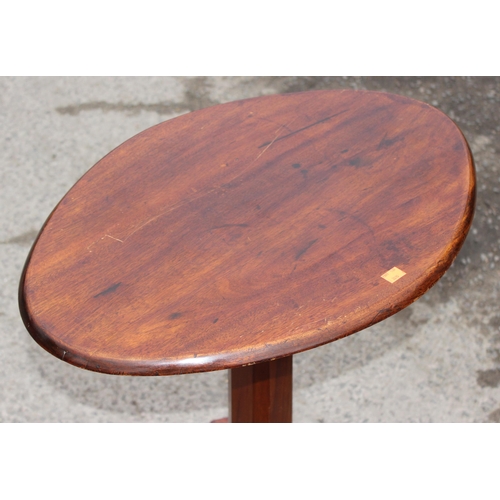44 - An antique oval topped mahogany side table with tripod pedestal base, approx 63cm wide x 45cm deep x... 