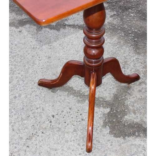 46 - A small Georgian mahogany tilt top table on tripod base, approx 69cm wide x 46cm deep x 74cm tall