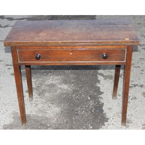 71 - An antique oak console or side table with single drawer and fold over top, approx 88cm wide x 91cm d... 