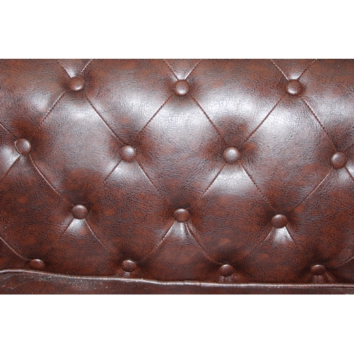 90 - An antique style Chesterfield buttonback club or tub chair, brown faux leather, approx 100cm wide x ... 