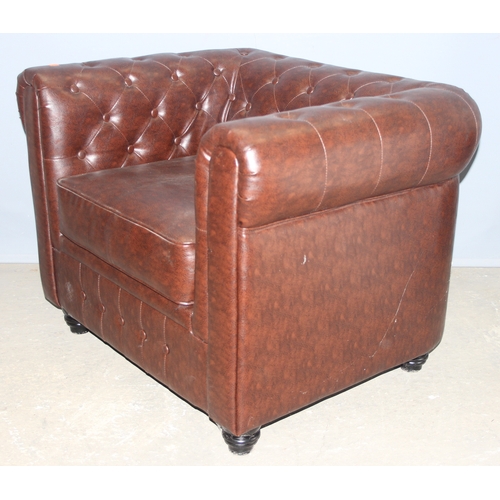 87 - An antique style Chesterfield buttonback club or tub chair, brown faux leather, approx 100cm wide x ... 