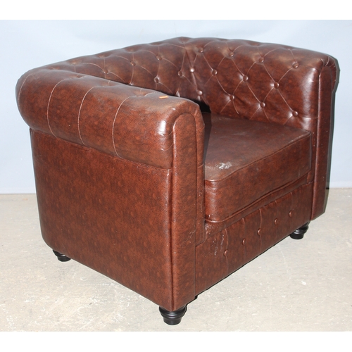 88 - An antique style Chesterfield buttonback club or tub chair, brown faux leather, approx 100cm wide x ... 