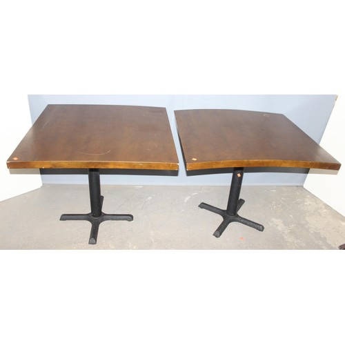 100 - A pair of metal base and square topped café or restaurant tables, each approx 90cm square x 73cm tal... 