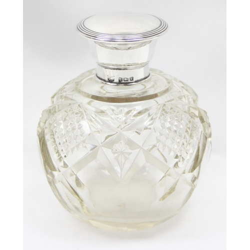 1049 - An antique grenade shaped perfume bottle with silver top and cut glass body, Birmingham 1920, makers... 