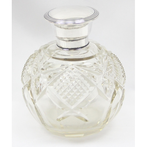 1049 - An antique grenade shaped perfume bottle with silver top and cut glass body, Birmingham 1920, makers... 