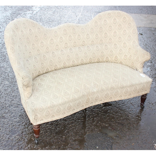 72 - An antique mahogany framed love seat or settee with brass and ceramic castors, approx 150cm wide