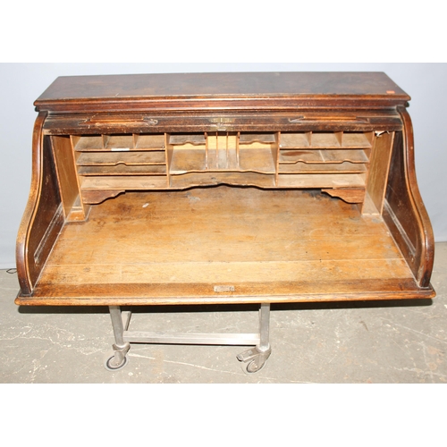 74 - An antique oak roll top desk with tambour front, approx 127cm wide x 76cm deep x 126cm tall