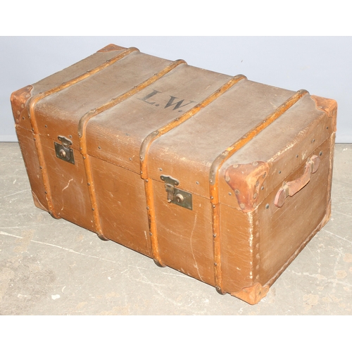 81 - An early 20th century flat topped wooden and canvas lined shipping trunk by Boswell & Co of Oxford, ... 