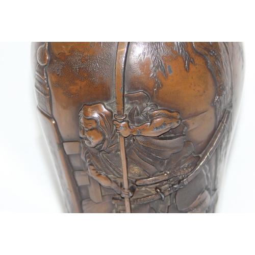 1673 - An exquisite Japanese Meiji period (1868-1912) metal vase depicting Samurai warriors, the vase made ... 