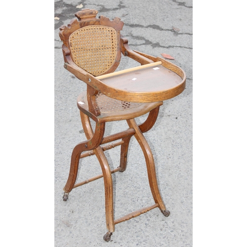 60A - An antique oak bergere seated child's high chair, approx 90cm tall