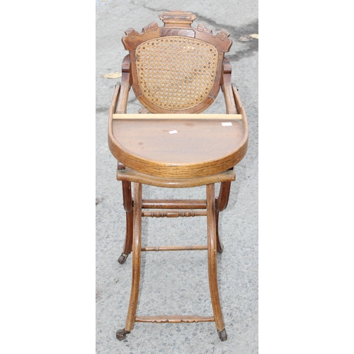 60A - An antique oak bergere seated child's high chair, approx 90cm tall