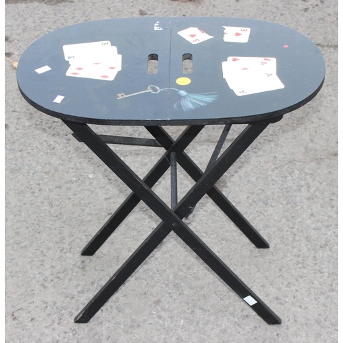 65A - An unusual vintage folding magician's table with decoupage and painted details, approx 55cm wide x 3... 