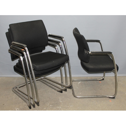 93B - A set of 4 retro style black and chrome stacking cantilever chairs by Komac