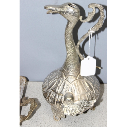 1014 - 2 Middle Eastern white metal items consisting of a long necked bird wine ewer and a rectangular heav... 