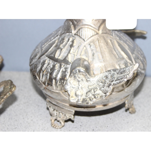 1014 - 2 Middle Eastern white metal items consisting of a long necked bird wine ewer and a rectangular heav... 