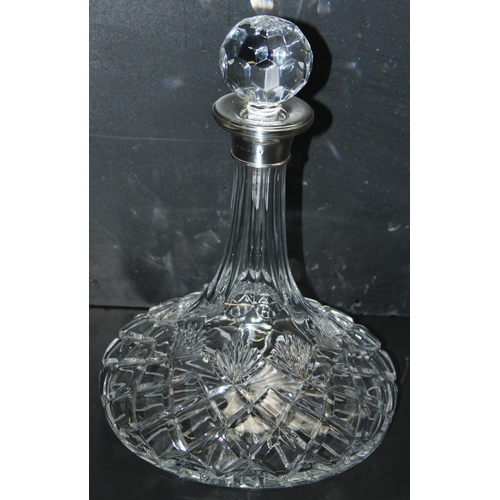 1025 - A silver mounted and cut crystal ships decanter, the collar marked for Birmingham 2001 by Broadway &... 