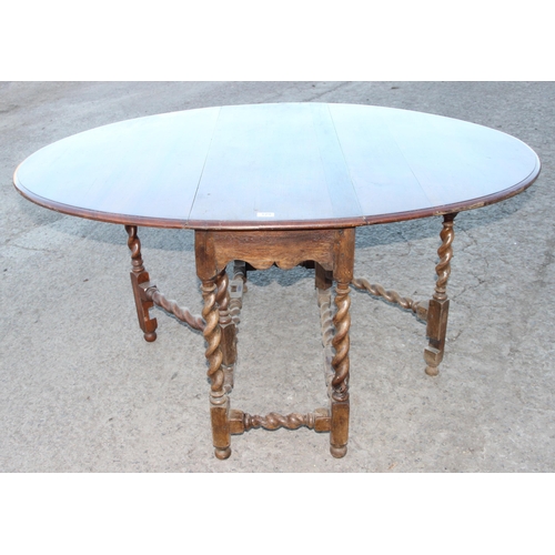 129 - Vintage dropleaf table with barleytwist legs, approx 154cm wide x 117cm deep x 75cm tall