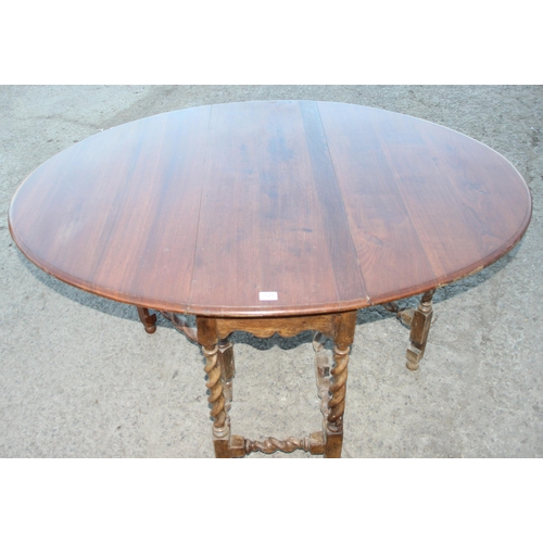 129 - Vintage dropleaf table with barleytwist legs, approx 154cm wide x 117cm deep x 75cm tall