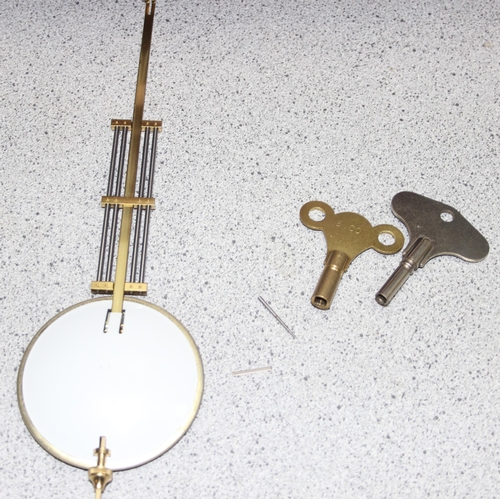 1320 - Light mahogany cased Vienna wall clock with brass finials, pendulum and key, approx 80cm