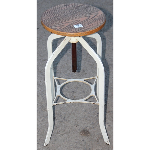 133 - A vintage industrial metal based machinists stool with adjustable oak seat, approx 70cm tall