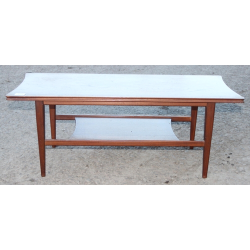 134 - A small retro coffee table with under-tier, seemingly unmarked but possibly by Richard Hornby for He... 