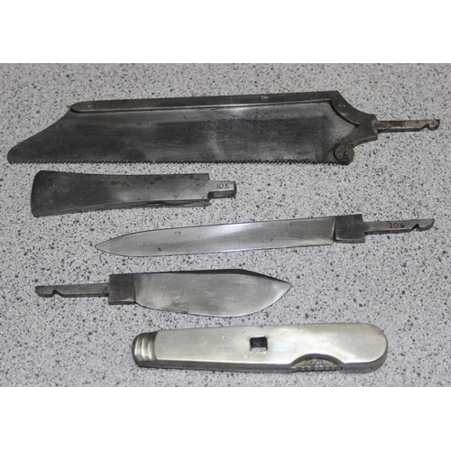 1403 - A vintage field surgeons set, possibly military but unmarked, 4 steel fittings and a handle, in maho... 