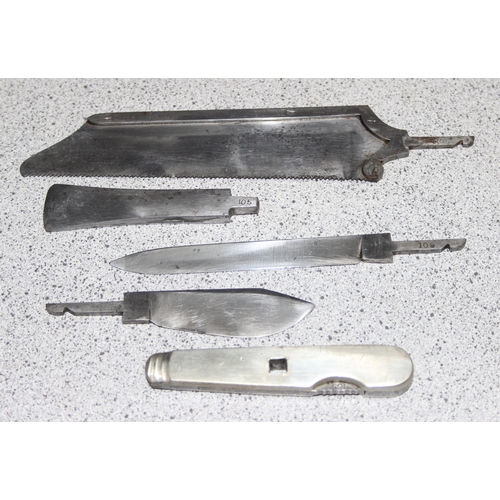 1403 - A vintage field surgeons set, possibly military but unmarked, 4 steel fittings and a handle, in maho... 