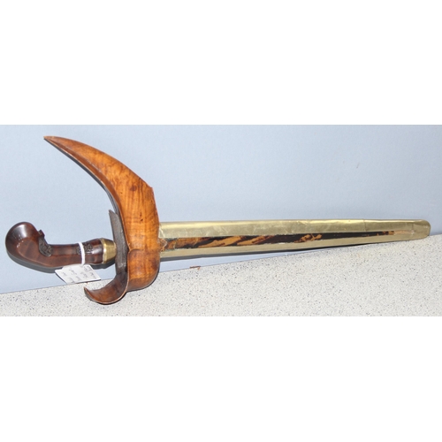 1409 - An Indonesian Kris or Keris dagger with Damascus steel blade and tortoiseshell inlaid sheath, approx... 