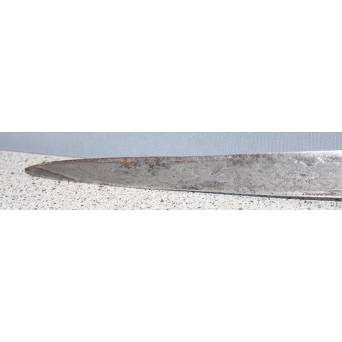 1409 - An Indonesian Kris or Keris dagger with Damascus steel blade and tortoiseshell inlaid sheath, approx... 