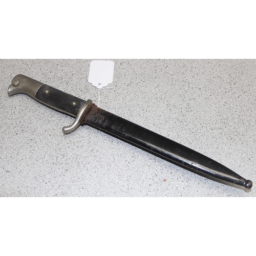 1412 - A German WW2 period K98 dress bayonet and scabbard, knights helmet mark to ricasso, approx 32cm long