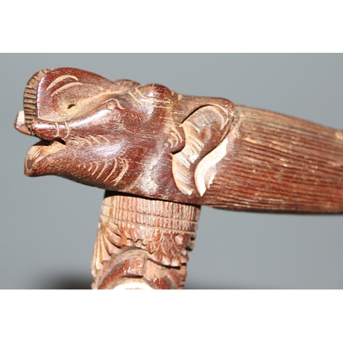 1610 - An unusual carved hardwood walking stick with Elephant handle, profusely carved, likely Indian, appr... 