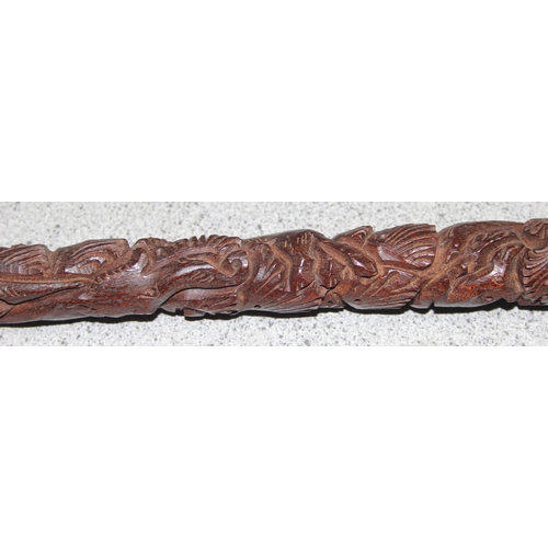 1610 - An unusual carved hardwood walking stick with Elephant handle, profusely carved, likely Indian, appr... 