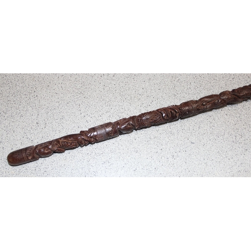 1610 - An unusual carved hardwood walking stick with Elephant handle, profusely carved, likely Indian, appr... 