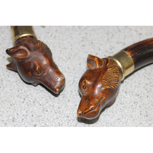 1612 - 2 walking sticks with dog head terminals and gold plated mounts, one cut down, the longest approx 91... 