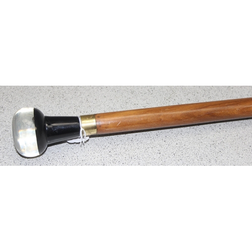 1612A - A hardwood walking cane with intaglio style Scottie Dog pommel, approx 90cm long