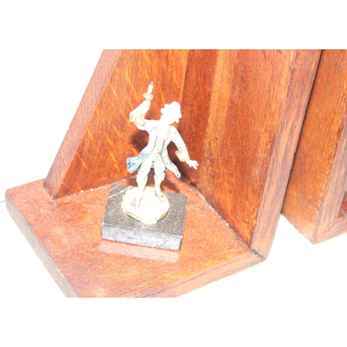 1700 - Pair of homemade wooden bookends mounted with small Rococo style figurines, approx 16cm tall