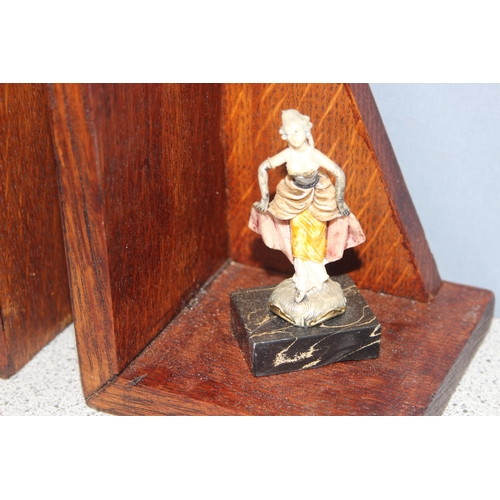 1700 - Pair of homemade wooden bookends mounted with small Rococo style figurines, approx 16cm tall