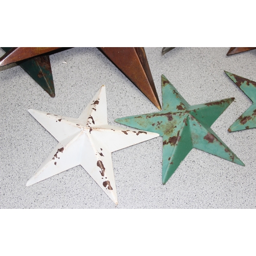 1734 - Collection of 7 vintage painted Amish barn tinware stars of varying sizes